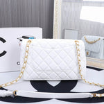 The coveted Chanel Timeless bag 23cm with lined flap in white quilted lambskin, garniture en métal doré