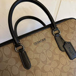 coach bag business in a luxurious brown color