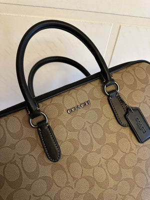 coach bag business in a luxurious brown color