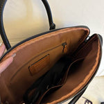 coach bag business in a luxurious brown color