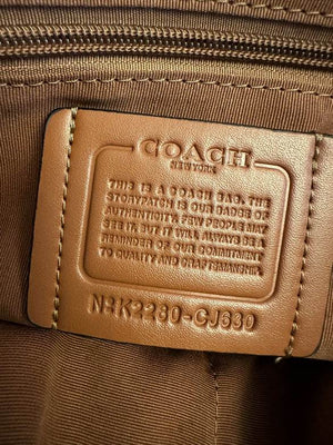 coach bag business in a luxurious brown color