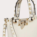 ROCKSTUD CROSSBODY POUCH IN GRAINY CALFSKIN