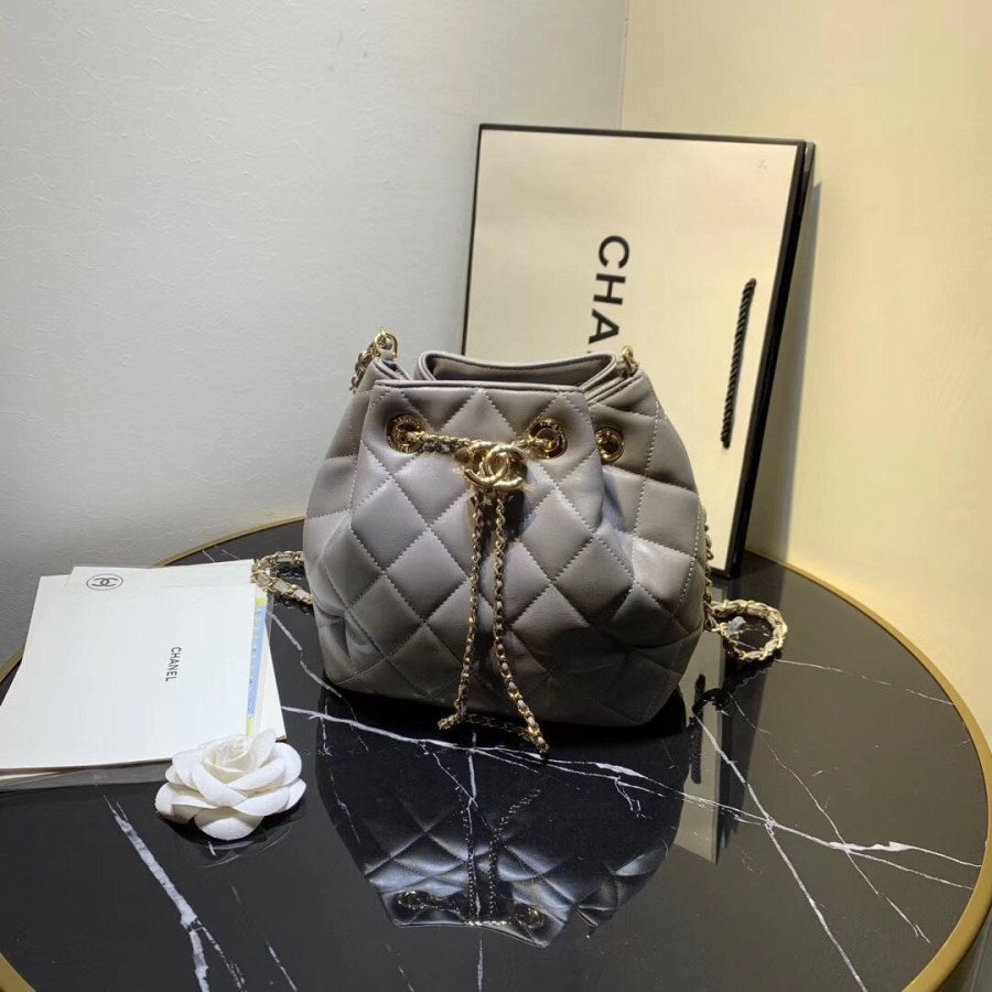 CHANEL Lambskin Quilted CC Dweller Drawstring Bucket Bag Light Grey