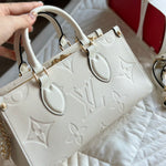 Cream Monogram Empreinte Leather OnTheGo MM - Leather Tote Bag for Women