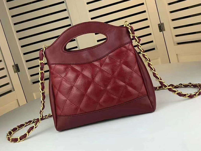 CHANEL SHOPPING BAG CALFSKIN & GOLDEN TONE METAL BURGUNDY