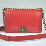 BOY CHANEL FLAP BAG IN GLAZED CALFSKIN RED IN BRONZE HARDWARE