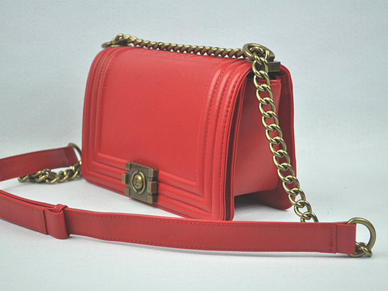 BOY CHANEL FLAP BAG IN GLAZED CALFSKIN RED IN BRONZE HARDWARE