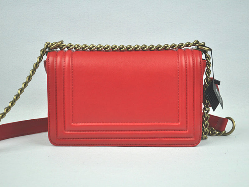 BOY CHANEL FLAP BAG IN GLAZED CALFSKIN RED IN BRONZE HARDWARE