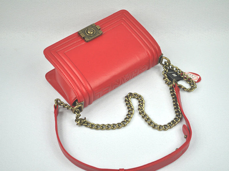 BOY CHANEL FLAP BAG IN GLAZED CALFSKIN RED IN BRONZE HARDWARE